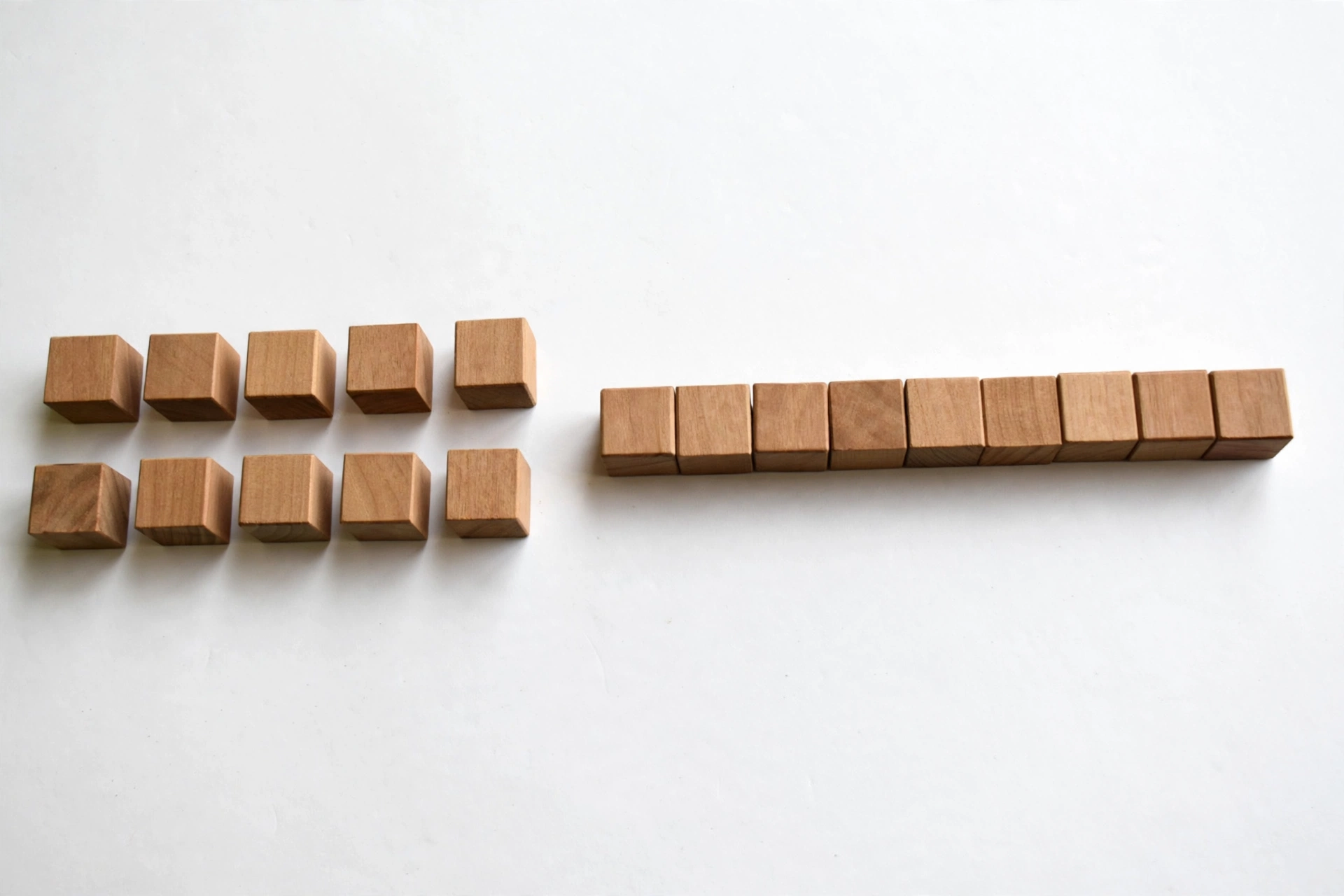 Ten unit cubes beside one ten rod showing unitizing concept